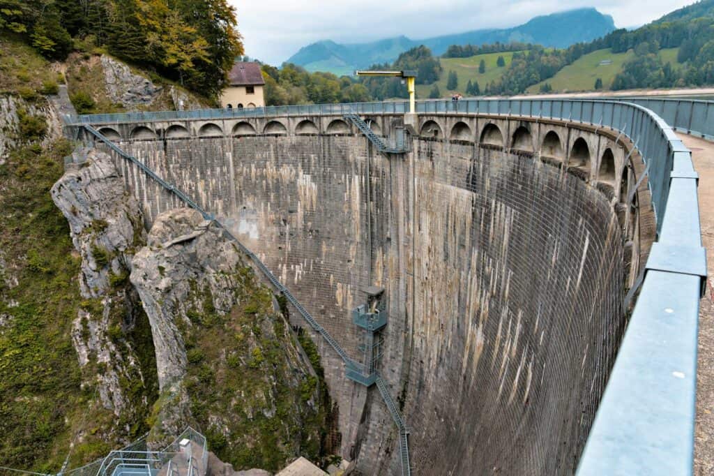 Majestic Rossens Dam surrounded by mountains and lush greenery in Broc, Switzerland.