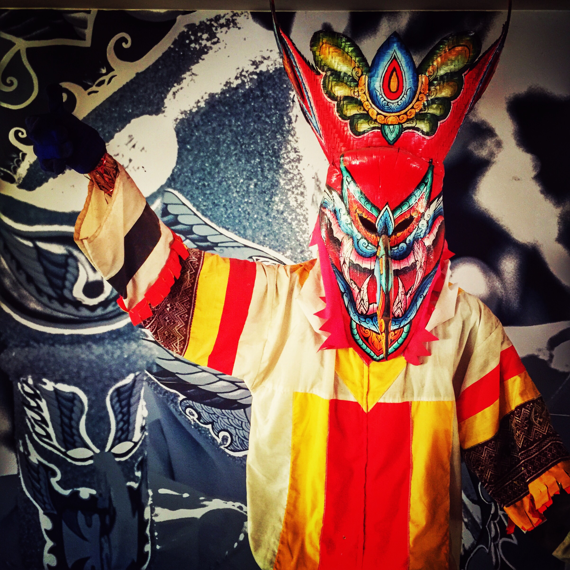 Phi Ta Khon ghost parade procession through the streets of Dan Sai with masked participants in colourful costumes