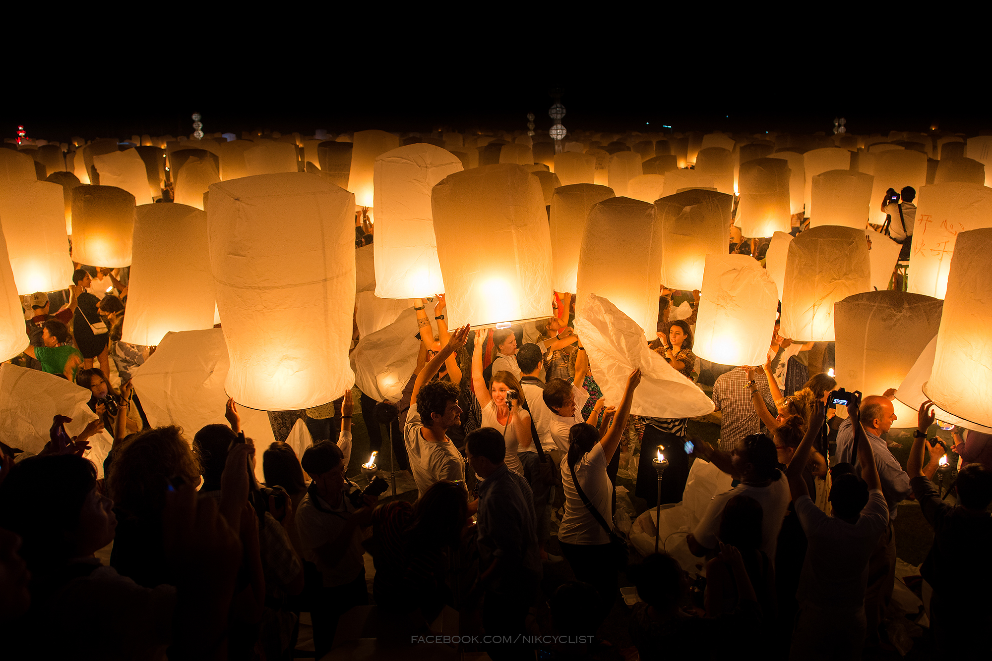 Yi Peng sky lanterns floating above Chiang Mai at night